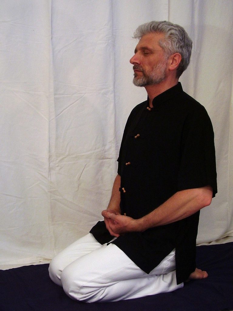 man-kneeling-on-his-heels-with-toes-flat-on-the-floor